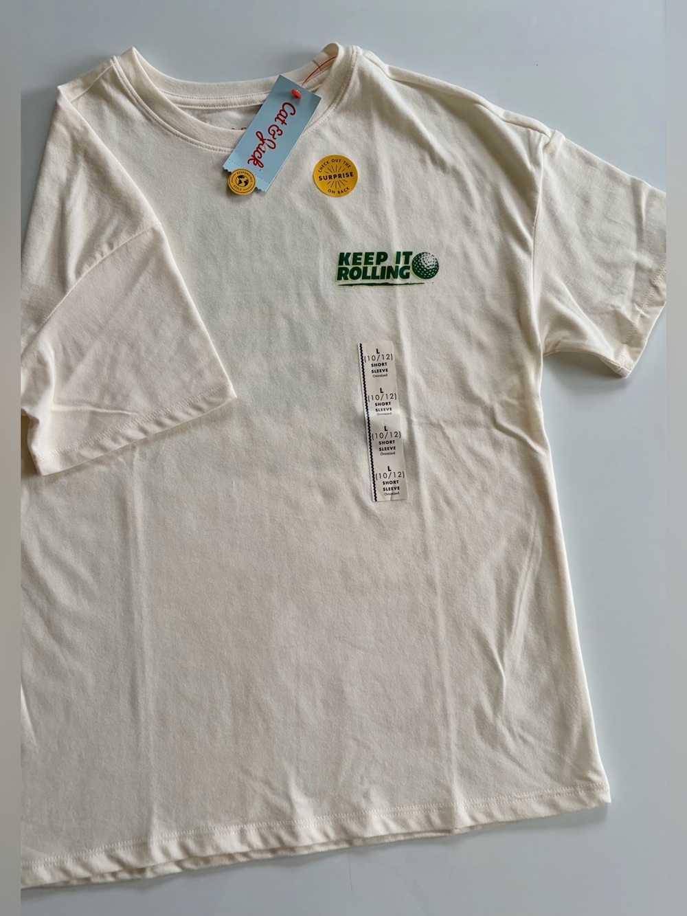 Cat & Jack Cream Short Sleeve Tee with Green "Keep It Rolling" Graphic